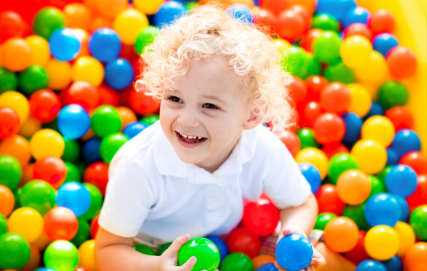 Visitor in ball pit at Jungle Tumble
